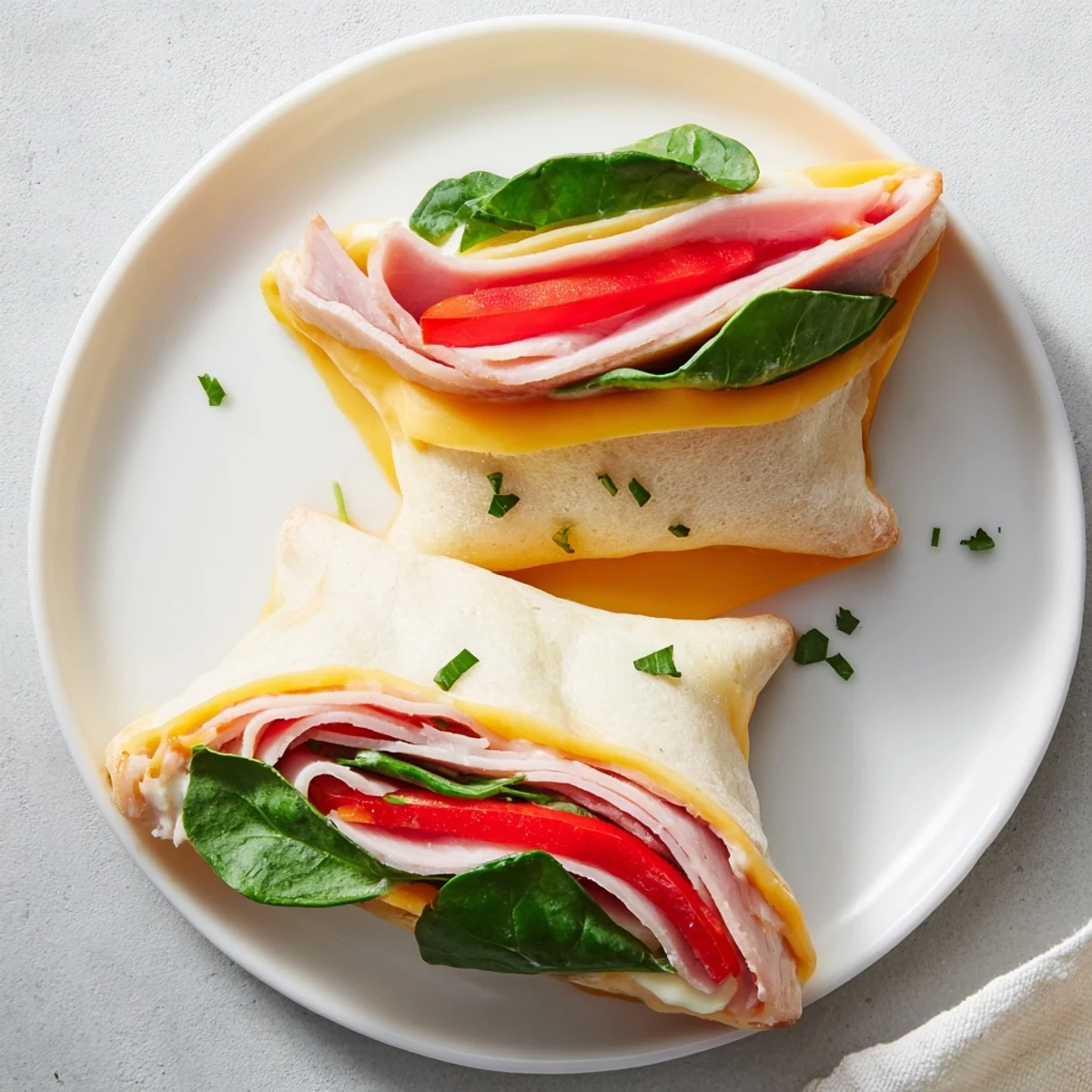 Freshly cut star-shaped party sandwiches with vibrant layers of turkey, ham, and cheese, ready to enjoy.