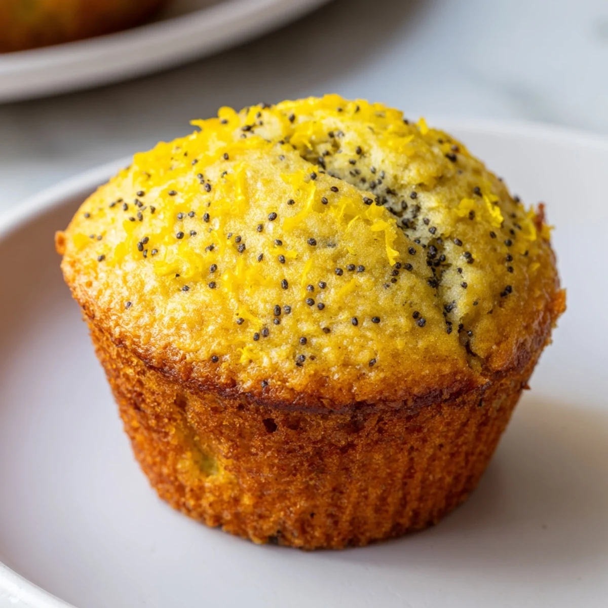 Golden-topped Lemon Poppy Seed Muffins, fresh from the oven, ready for a delicious breakfast treat.