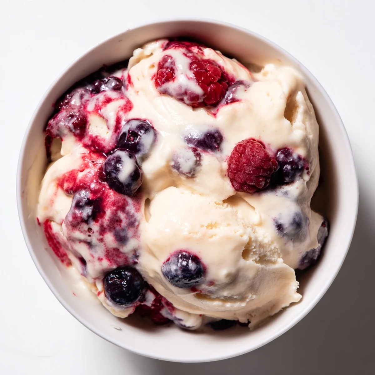 Delicious, protein-packed cottage cheese ice cream, made with fresh berries, offers a healthy treat option.