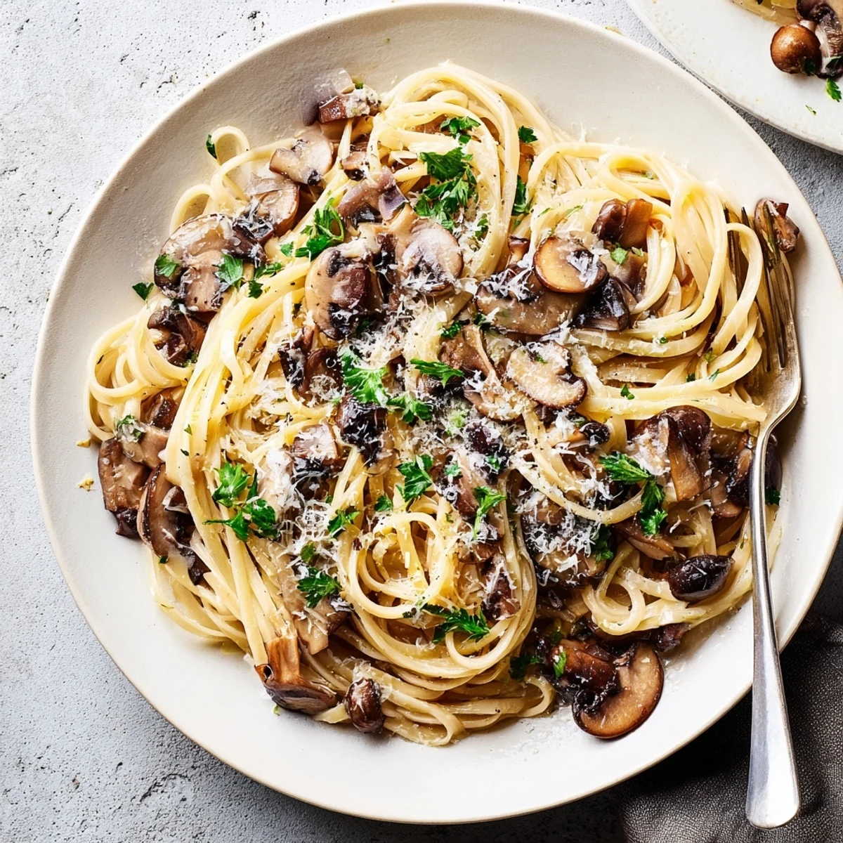 Creamy Mushroom Linguine features golden sautéed mushrooms and al dente linguine coated in a silky, light cream sauce.  