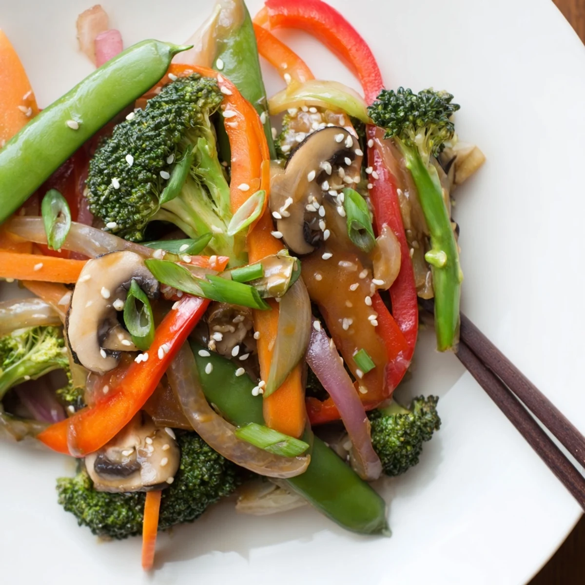 Sizzling ginger stir-fried vegetables with crisp broccoli, carrots, and snap peas, tossed in a savory soy sauce glaze.  