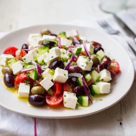 Holiday Mix featuring bright green and black olives with creamy feta cubes, ready to serve.