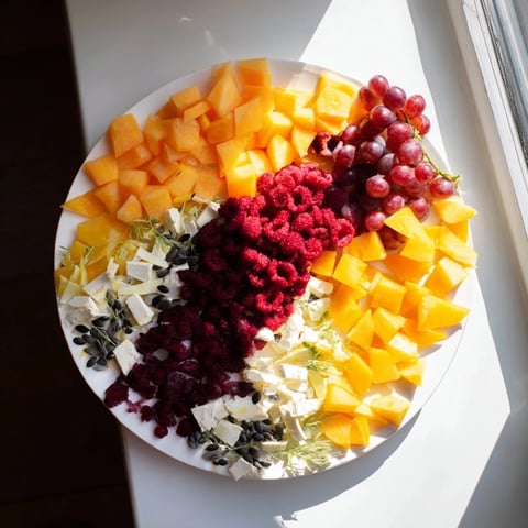 The Kinetic Motion Blur appetizer is a visually stunning arrangement of colorful vegetable slices.