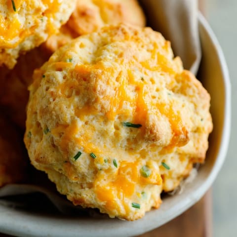 Close-up of a savory Chicken Cobbler featuring fluffy biscuits made with Red Lobster's biscuit mix atop a creamy filling.