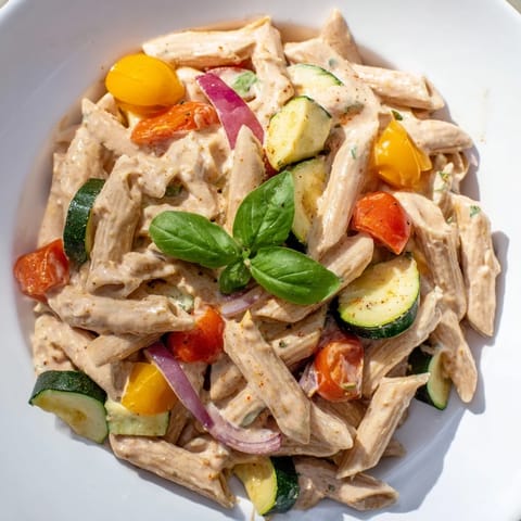 Bright red cherry tomatoes and golden feta make this baked feta pasta a colorful dish.