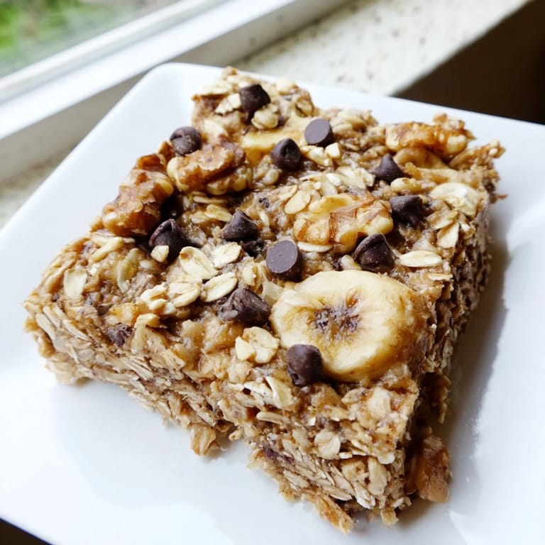 Golden-colored Peanut Butter Banana Oat Bars, offering a sweet and naturally filling energy bite.